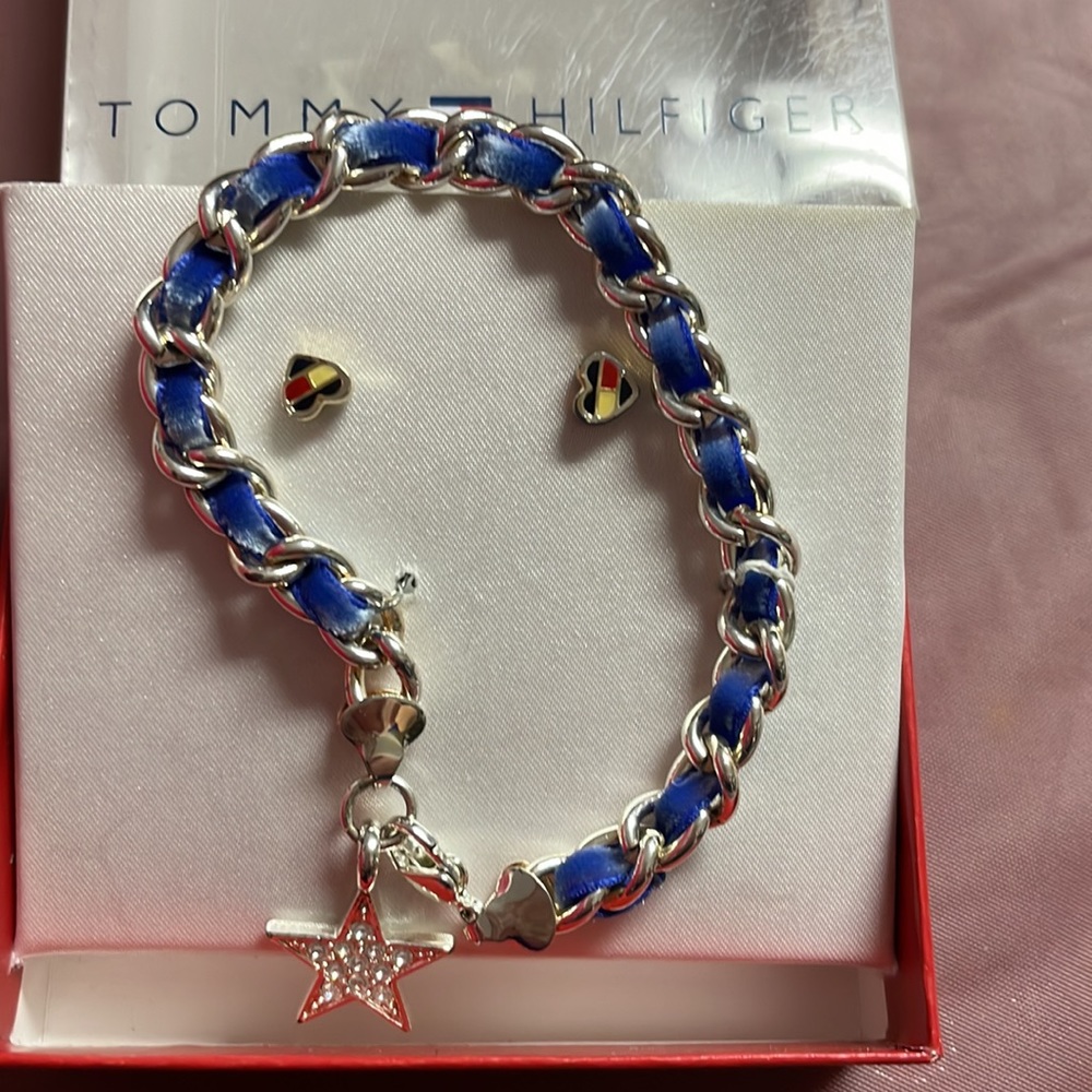 New in box Tommy Hilfiger silver super cute bracelet and small heart earrings.